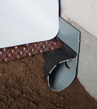 Closeup of a crawl space drainage system installed in Minnetonka