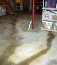 Flooding entering a basement through a floor crack in Elk River