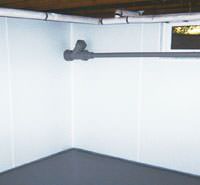 basement vapor barriers on the walls in a formerly leaky basement in Minneapolis, MN