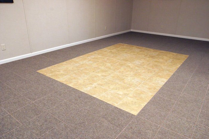 tiled and carpeted basement flooring installed in a Saint Cloud home