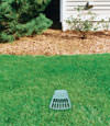 A buried gutter drain downspout extension installed in a Champlin home