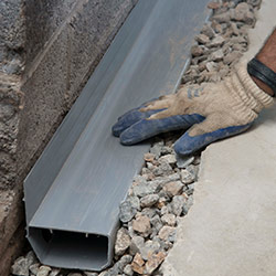 installing a drain tile system in a Plymouth home